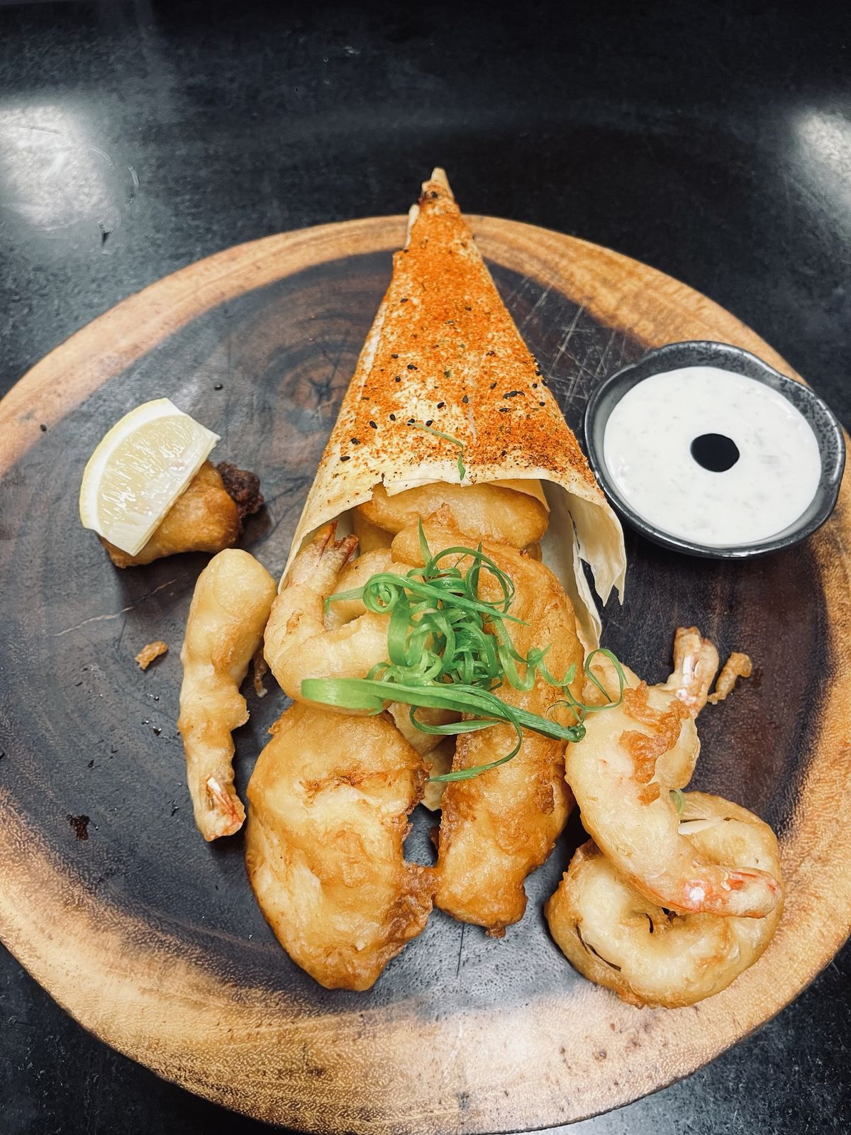 Battered prawns plated in the shape of a squid, with tartar sauce, by Chef Moreno Benigno