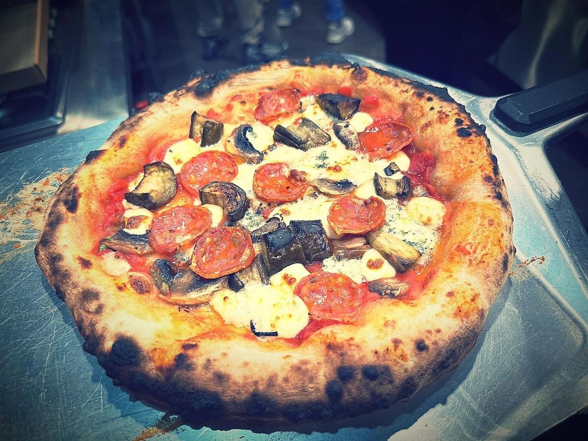 Pizza with salami, eggplant, mushrooms, mozzarella and blue cheese, by Chef Moreno Benigno